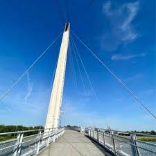 A view on Bob Kerrey Pedestrian Bridge on a sunny day with bright blue sky