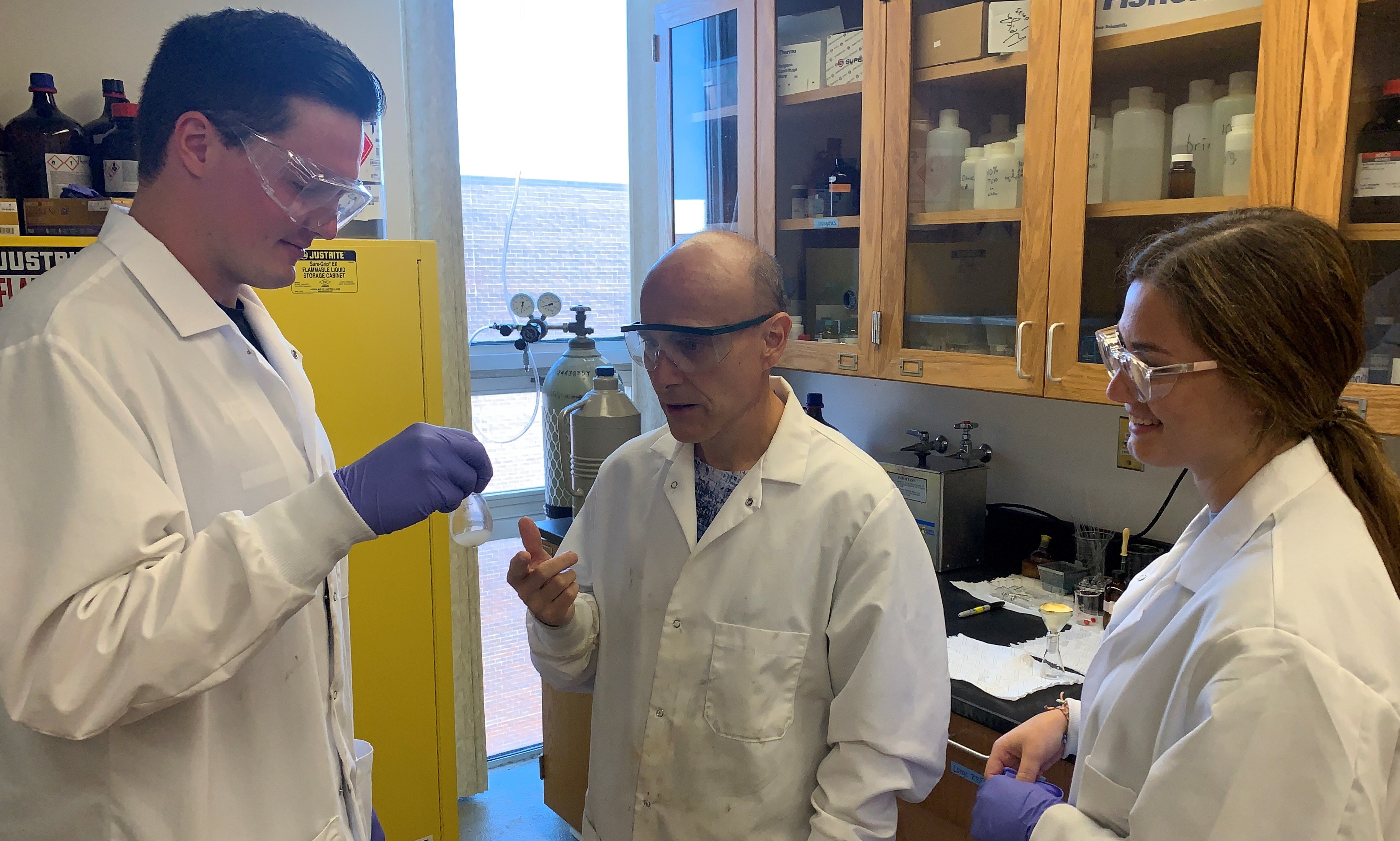 At the University of Nebraska at Kearney, undergrads Josh Bohlke (left) and Katie Lytle (right) work with Associate Professor Allen Thomas in a chemistry laboratory. Their summer research project was funded by Nebraska EPSCoR, with resources from the National Science Foundation (via OIA-2044049).