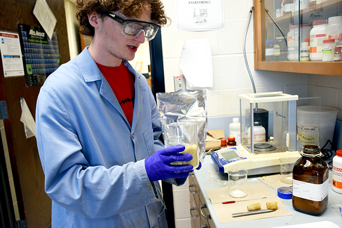 An undergraduate student from Central Community College conducts chemistry research in a lab during an experience funded by Nebraska EPSCoR.