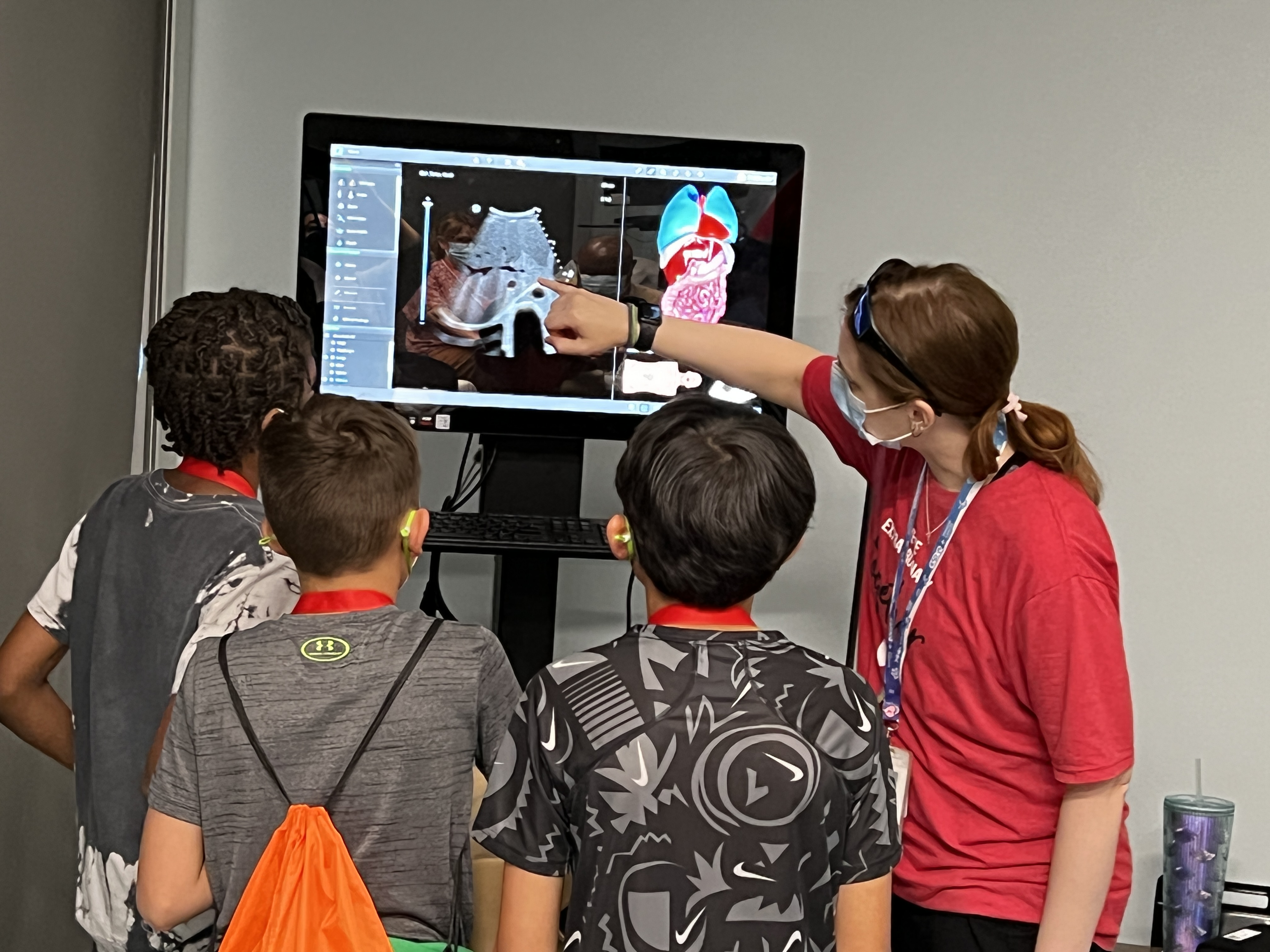 A group of indigenous students view a screen while learning about future careers in biomedicine and research at University of Nebraska Medical Center.