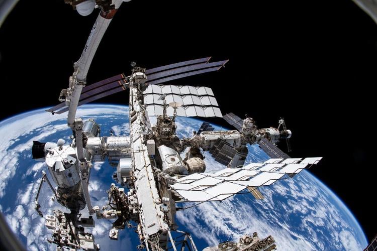 NASA photo of the International Space Station in orbit, with earth in the background